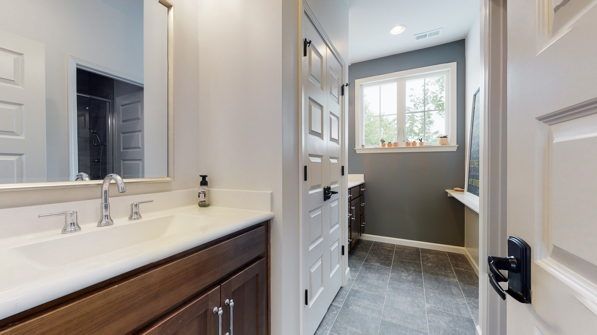 5530 Baker Road Murfreesboro, TN 37129 - Photo 27 of 49 This is the full bathroom upstairs that serves the three bedrooms. It has two identical vanities, separated by a large linen closet. Closed off by a door is the private commode and tiled shower across from the linen closet.