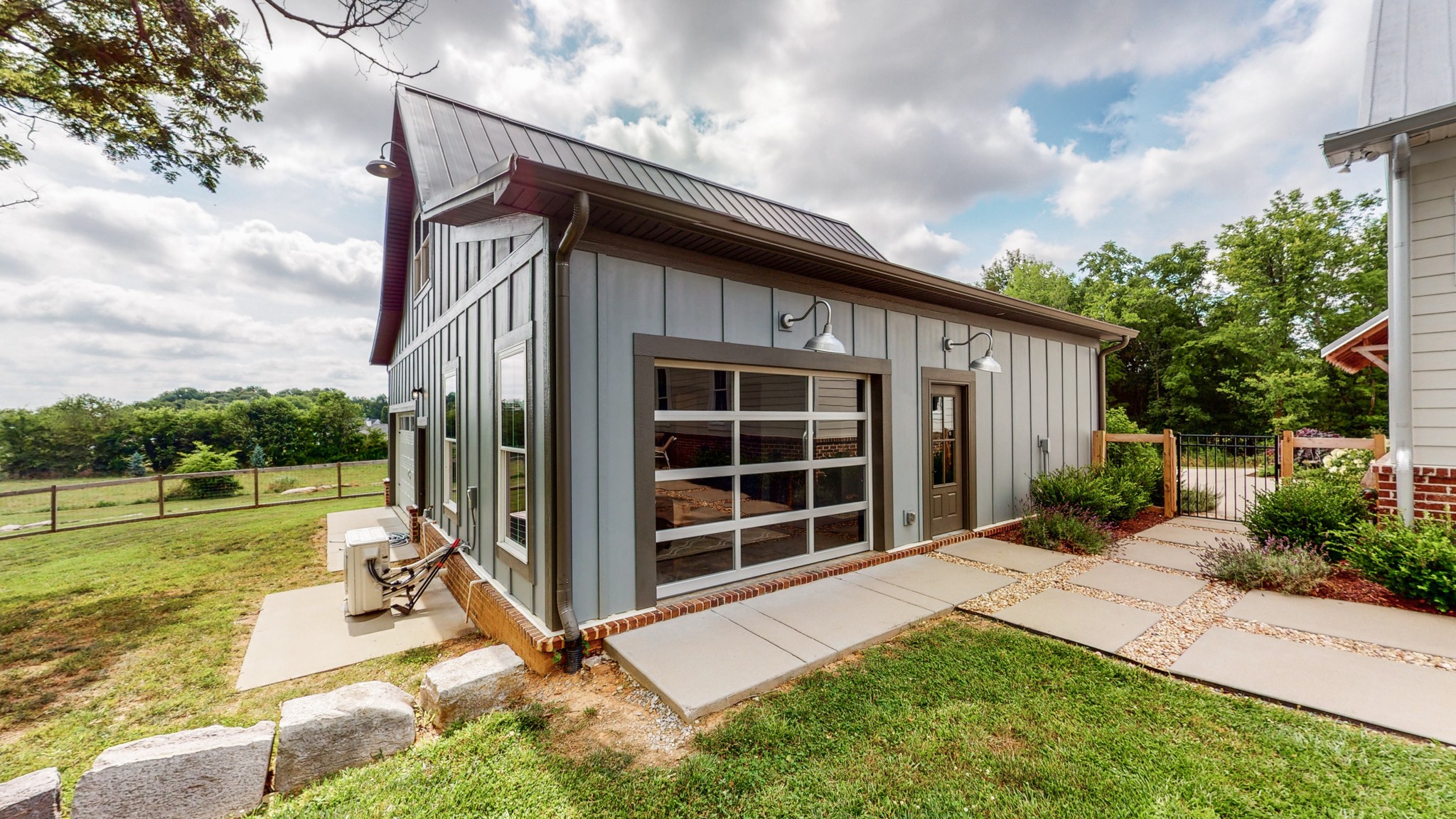 5530 Baker Road Murfreesboro, TN 37129 - Photo 36 of 49 So this building can really be whatever you need it to be. The insulated & windowed garage door leads directly into the living room area and can be raised. It has its own private entrance and garage.
