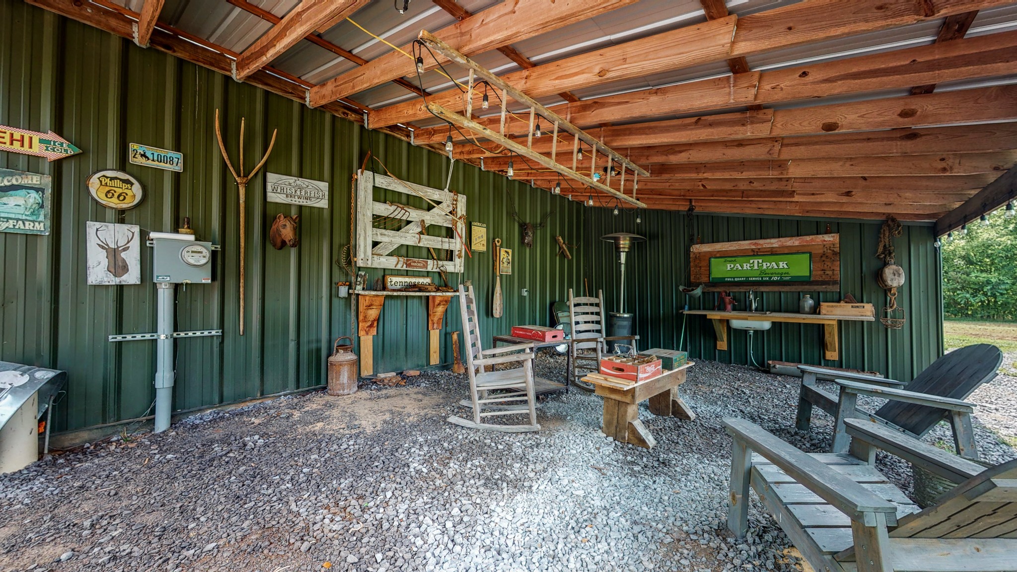 5530 Baker Road Murfreesboro, TN 37129 - Photo 43 of 49 The overhang of the workshop is a fun place to hang out, but can also be used to house farm equipment or trailers, or be turned into run-in shelter for animals.