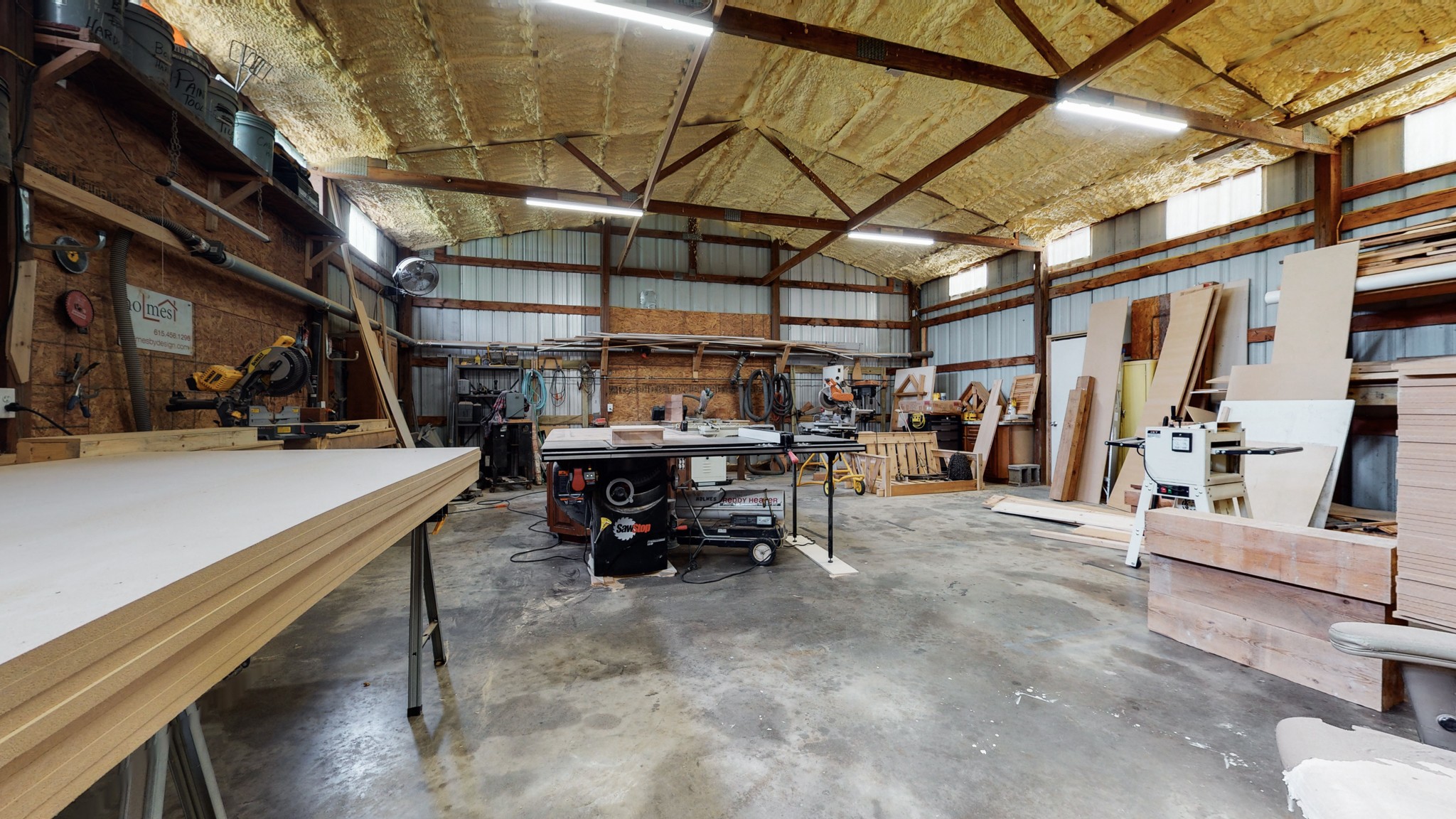 5530 Baker Road Murfreesboro, TN 37129 - Photo 44 of 49 Over 1400 sqr ft of space in this workshop! Concrete slab flooring. Great windows along the roofline, & insulated ceiling. Could be easily converted to house animals if needed, or store classic cars.. or boats... or have your own wood-working shop.