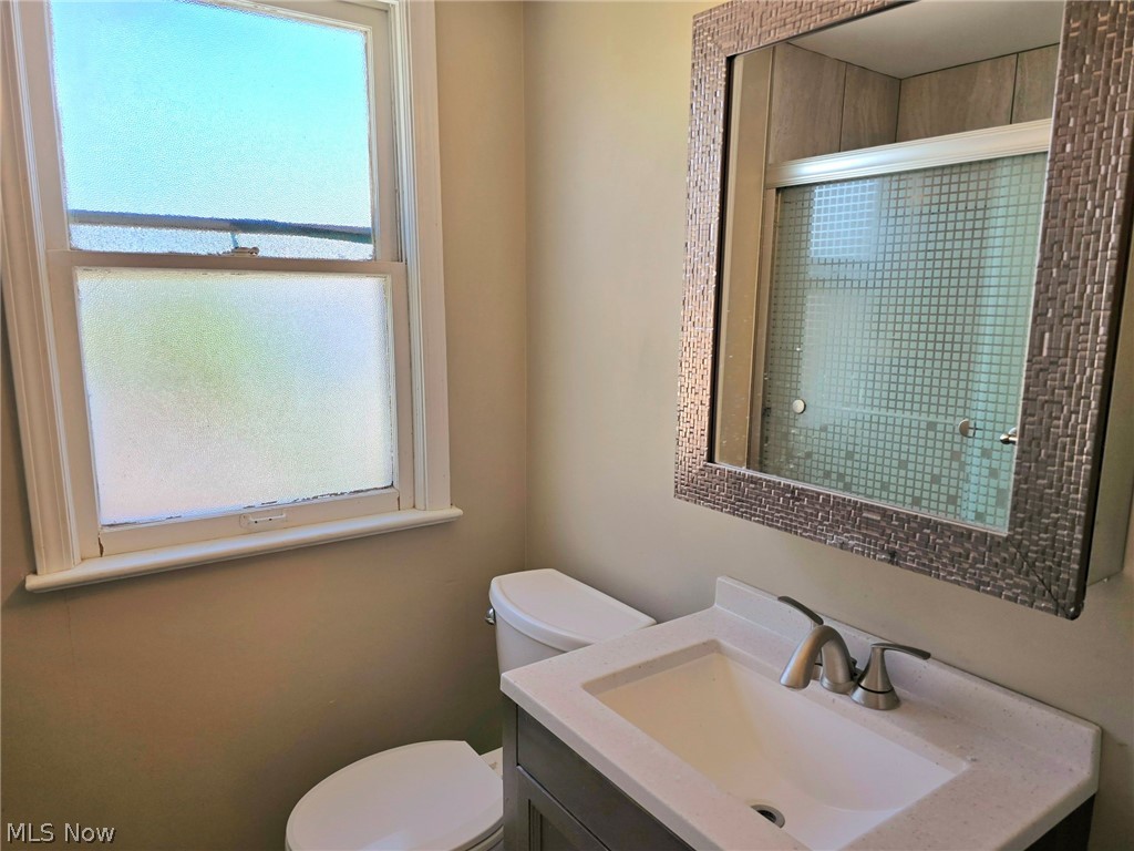 4111 Redfern Road Parma, OH 44134 - Photo 24 of 40 Second floor bathroom with decorative mirrored cabinet, toilet and vanity