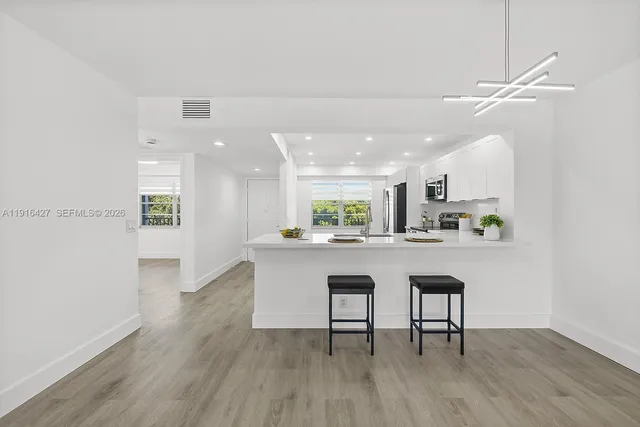 a view of workspace with wooden floor