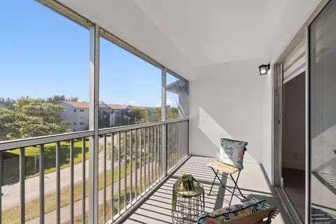 a view of balcony with furniture