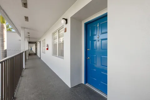a view of hallway with wooden floor