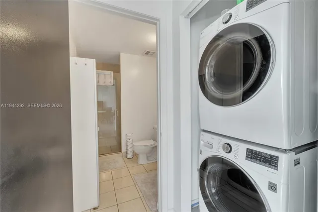 a view of a hallway with washer and dryer