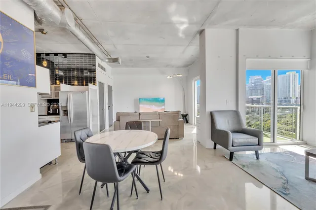 a view of a dining room with furniture window and outside view
