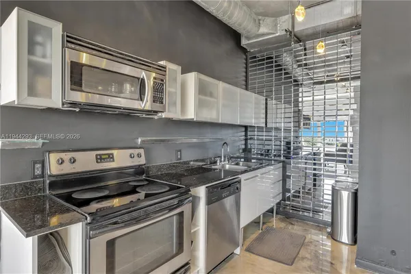 a kitchen with a stove and a microwave