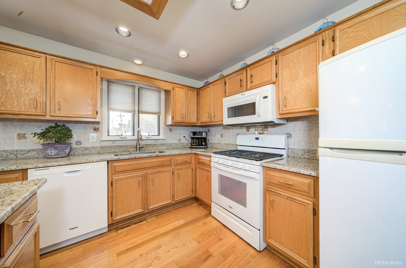 26253 South Ruby Street Monee, IL 60449 - Photo 13 of 45 a kitchen with stainless steel appliances granite countertop a stove a sink and white cabinets