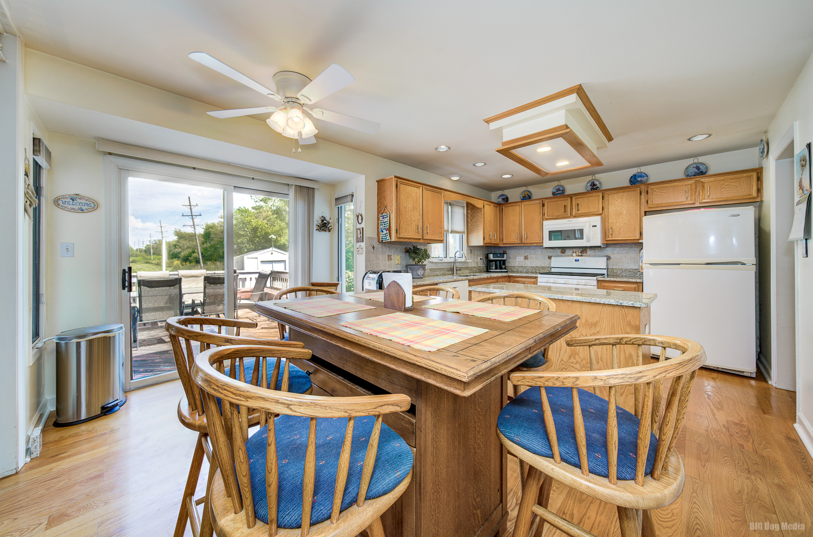 26253 South Ruby Street Monee, IL 60449 - Photo 16 of 45 a kitchen with stainless steel appliances a table chairs and a chandelier