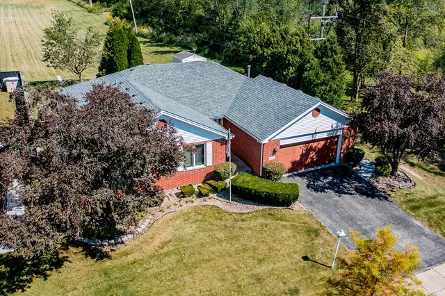 a aerial view of a house with a yard