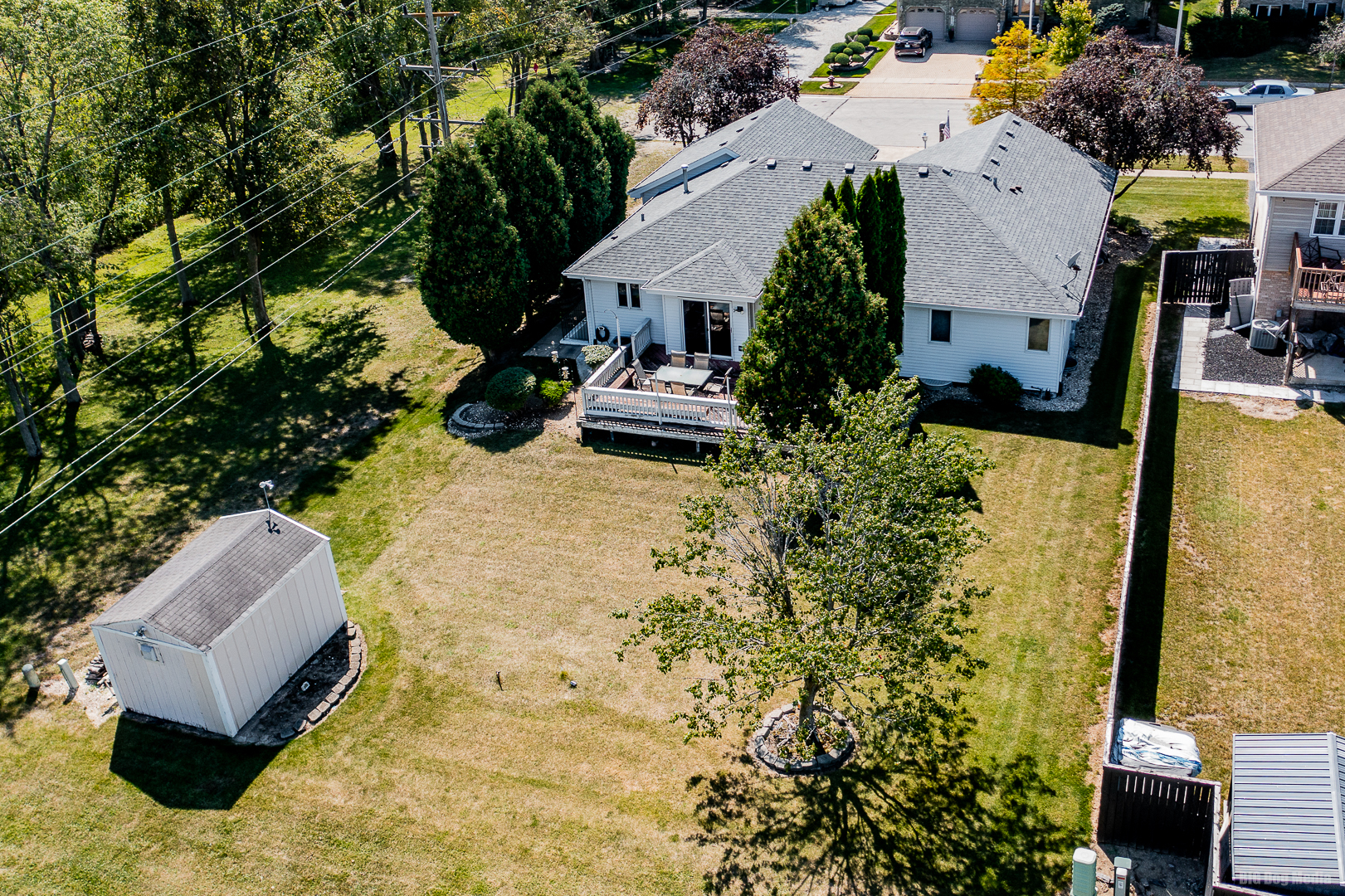 26253 South Ruby Street Monee, IL 60449 - Photo 45 of 45 an aerial view of a house with swimming pool and large trees
