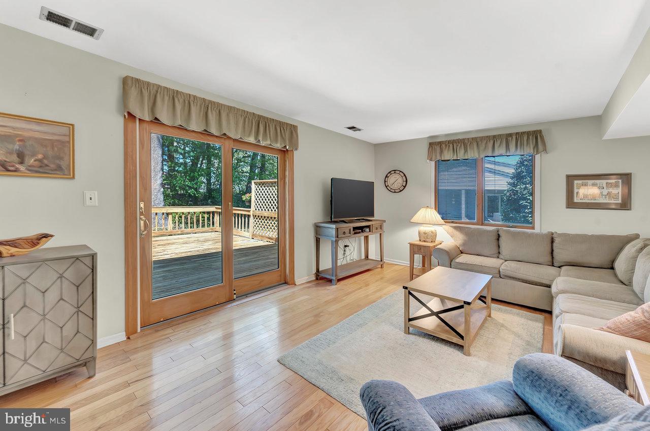 79 Wolfpack Road Hamilton, NJ 08619 - Photo 13 of 30 a living room with furniture and a flat screen tv