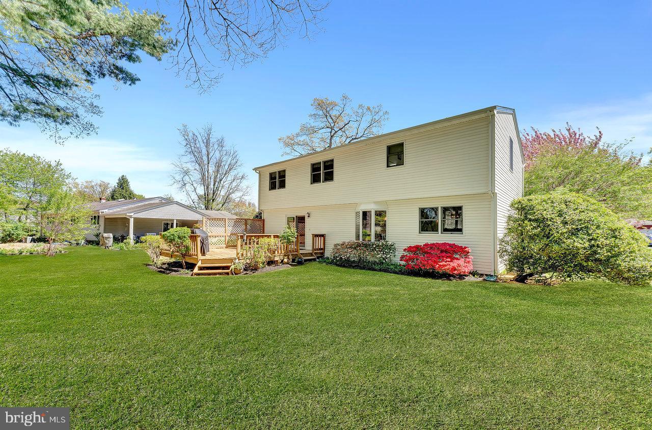 79 Wolfpack Road Hamilton, NJ 08619 - Photo 29 of 30 a view of a white house with a big yard and large trees
