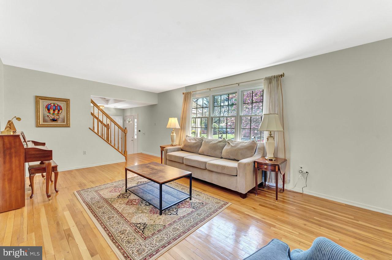 79 Wolfpack Road Hamilton, NJ 08619 - Photo 3 of 30 a living room with furniture and a wooden floor