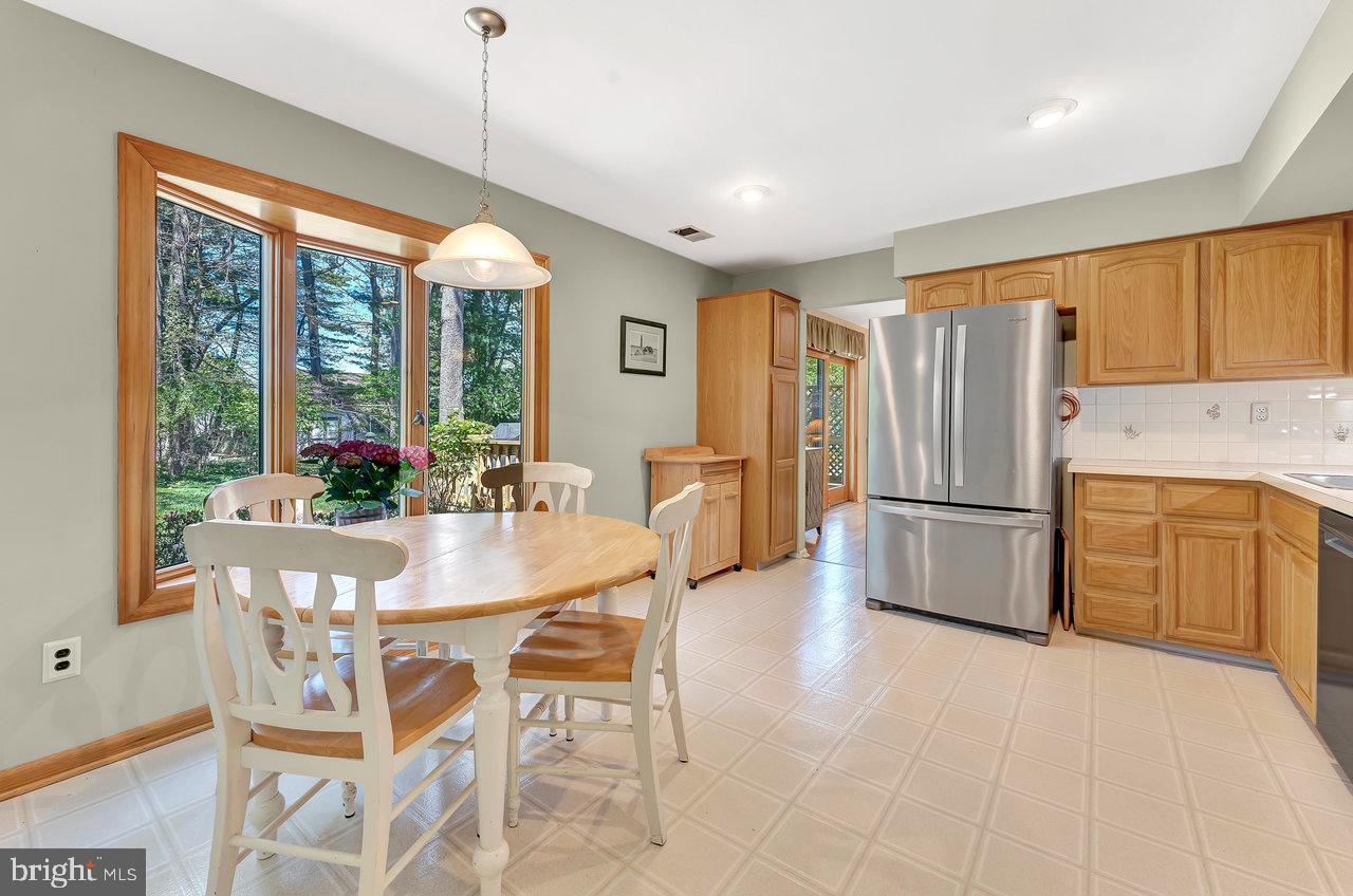 79 Wolfpack Road Hamilton, NJ 08619 - Photo 10 of 30 a dining room with furniture a chandelier and window
