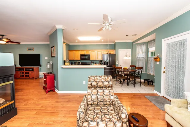 a living room filled with furniture and a flat screen tv