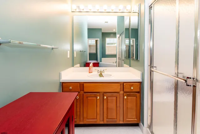 a room with a sink and a mirror