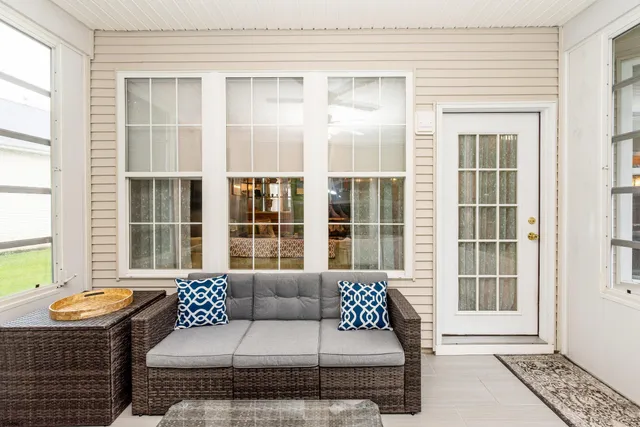 a living room with furniture and a window with outer view