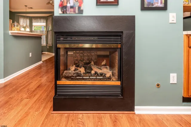 a view of fireplace and wooden floor