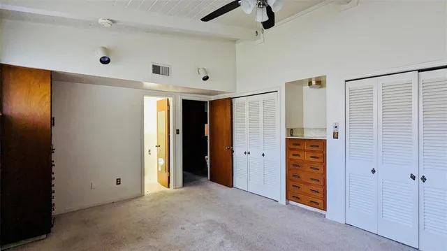 a view of a door and an empty room