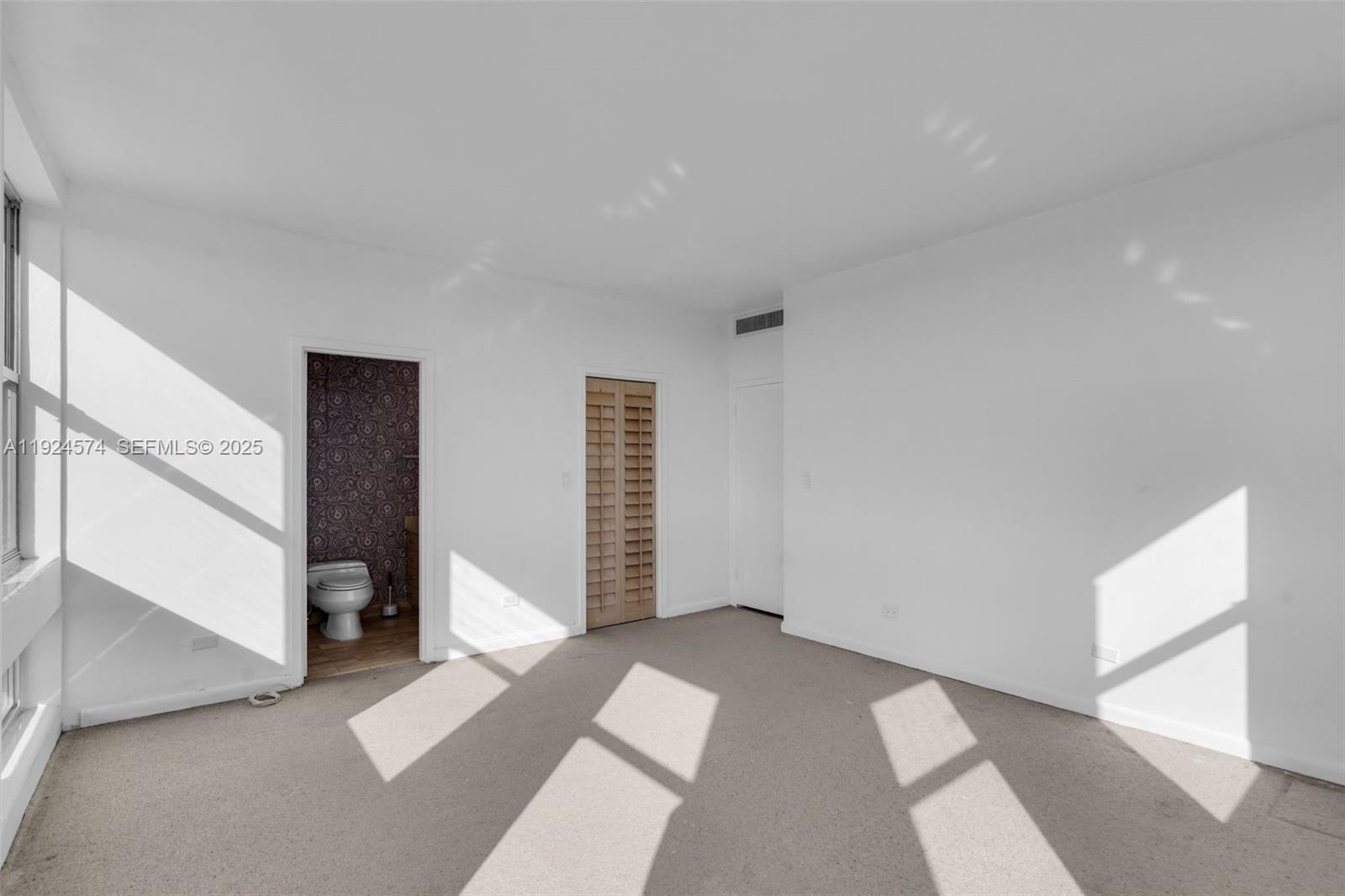 700 Biltmore Way, Unit 710 Coral Gables, FL 33134 - Photo 16 of 41 a view of an empty room with a window