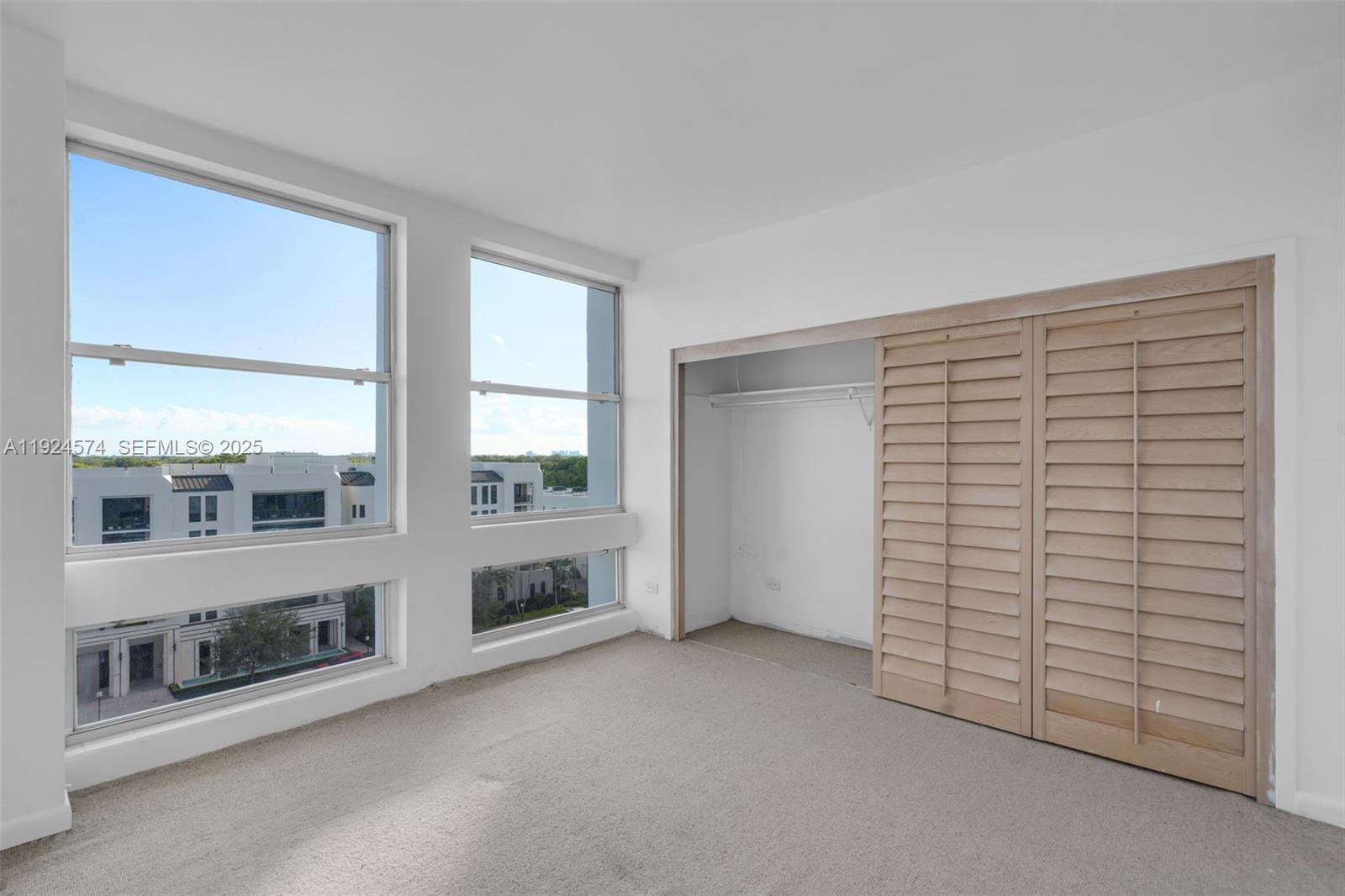 700 Biltmore Way, Unit 710 Coral Gables, FL 33134 - Photo 20 of 41 an empty room with windows