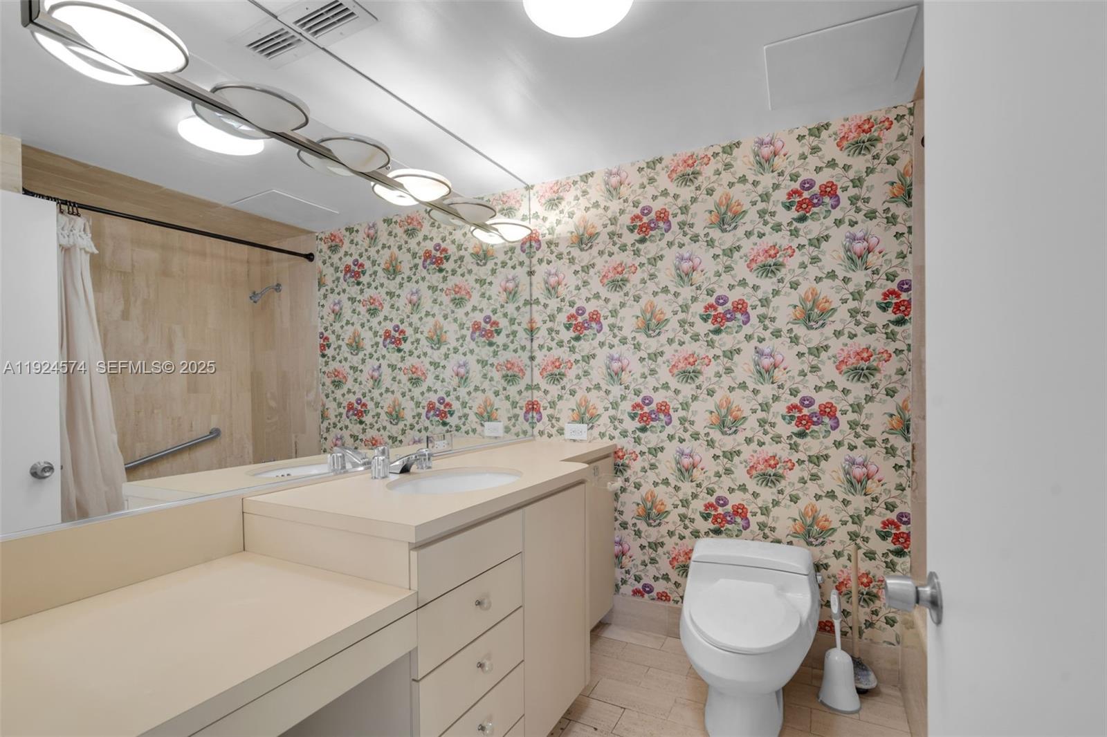 700 Biltmore Way, Unit 710 Coral Gables, FL 33134 - Photo 23 of 41 a bathroom with a sink toilet and shower