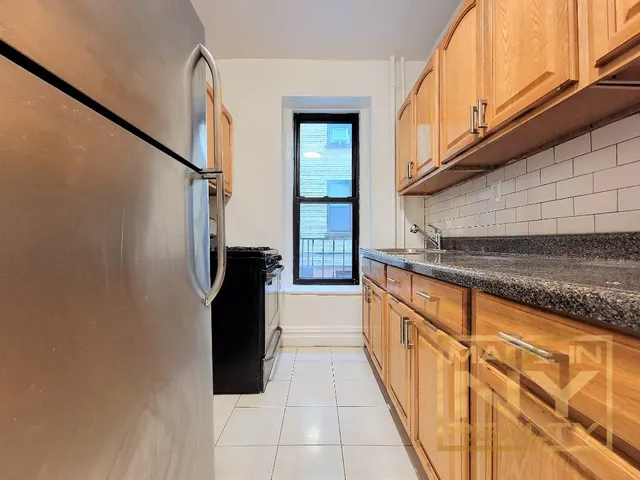 a view of a kitchen with a sink