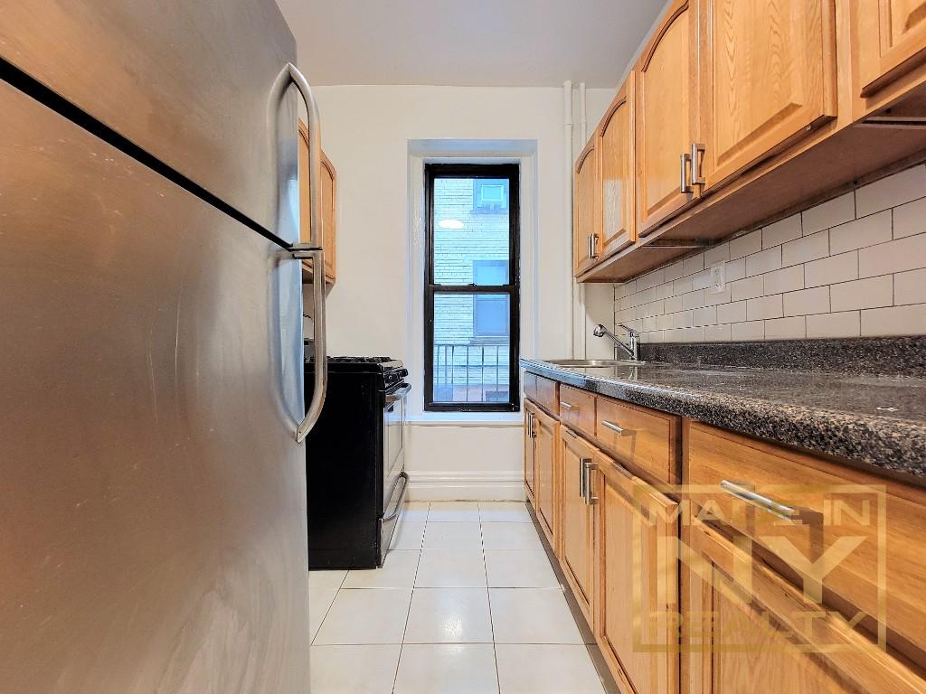 a view of a kitchen with a sink