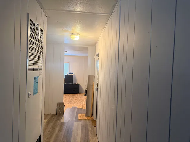 a view of a bedroom from a hallway