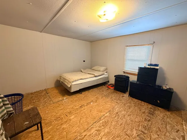 a bedroom with a bed and furniture