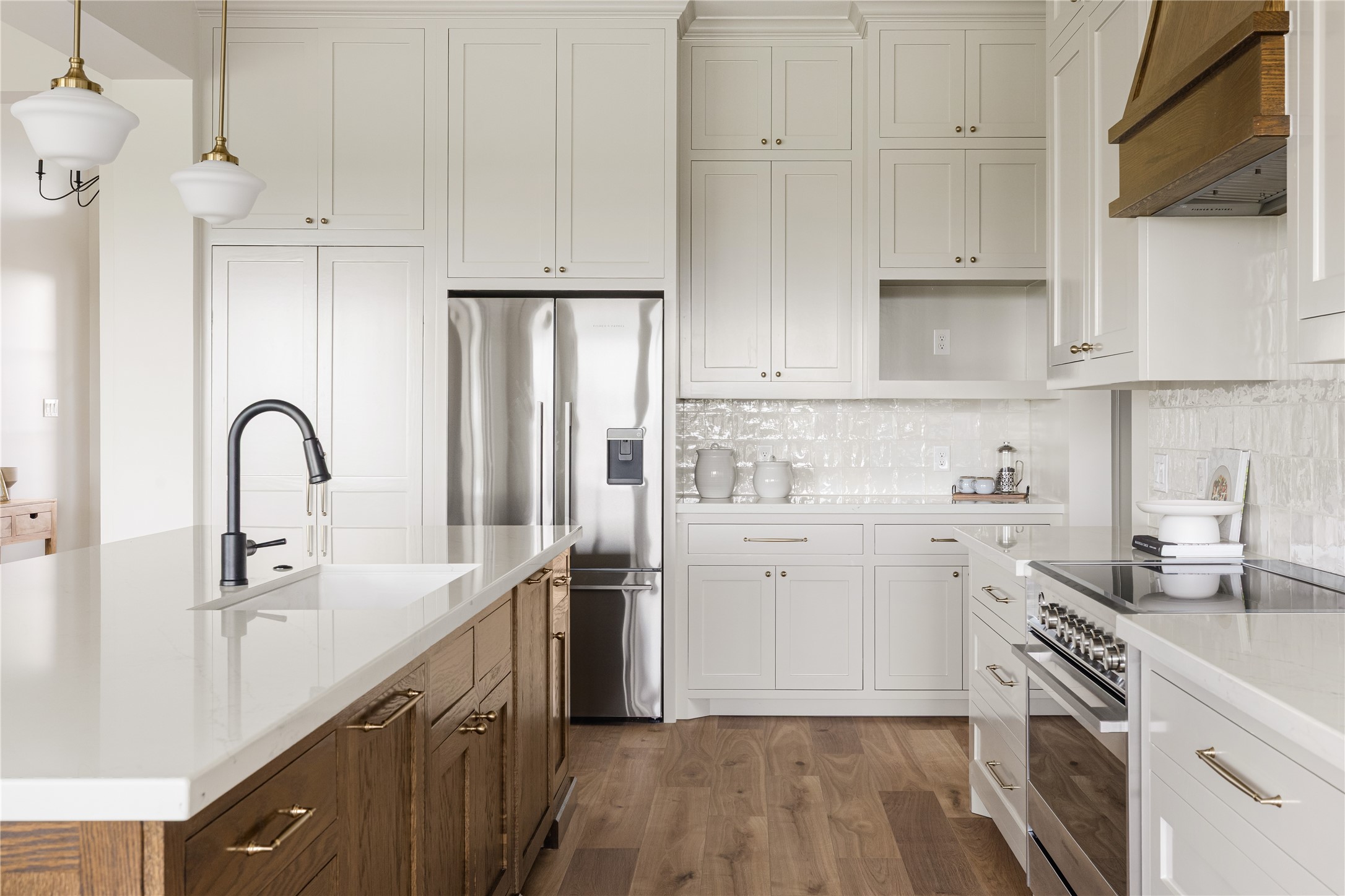 1355 Bluebonnet Ridge Drive Chappell Hill, TX 77426 - Photo 11 of 37 a kitchen with stainless steel appliances granite countertop a sink stove and refrigerator