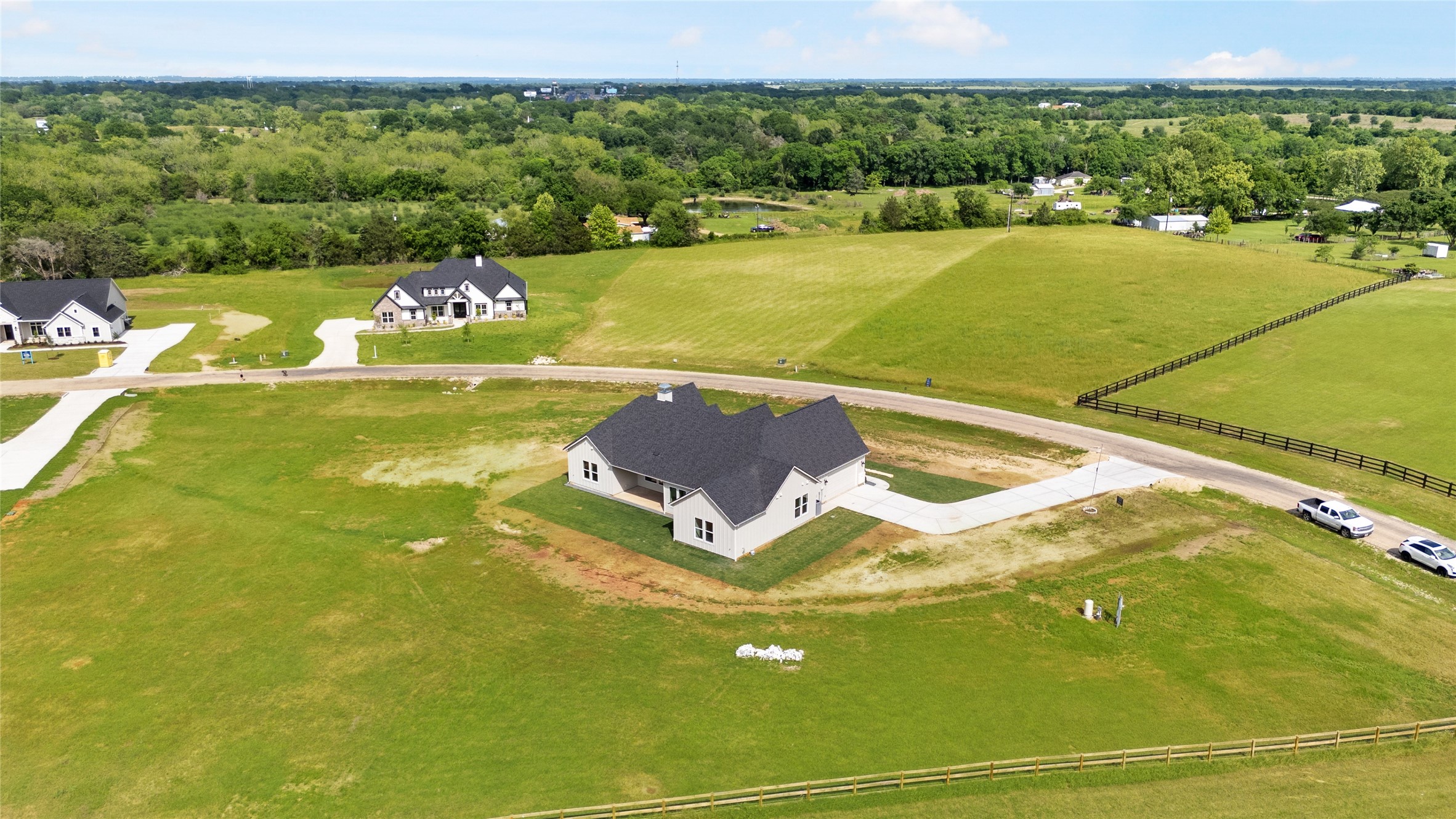 1355 Bluebonnet Ridge Drive Chappell Hill, TX 77426 - Photo 37 of 37 a view of a lake with a houses