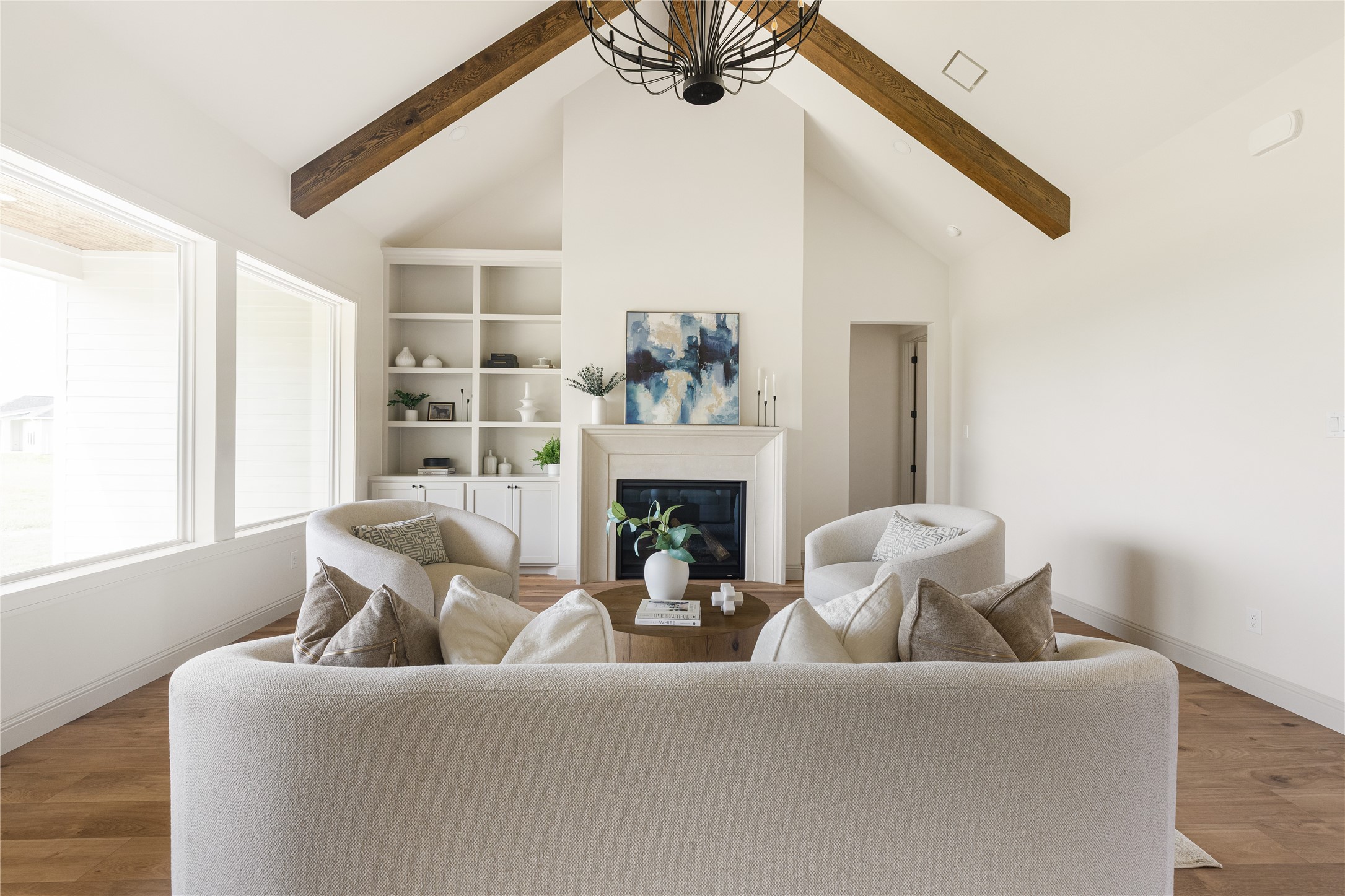 1355 Bluebonnet Ridge Drive Chappell Hill, TX 77426 - Photo 10 of 37 a living room with furniture a fireplace and a large mirror