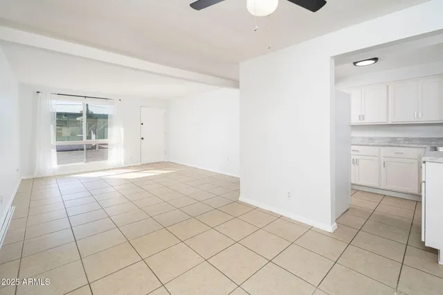 a view of kitchen with white cabinets