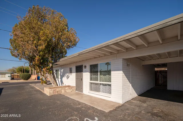 a view of a house with a tree
