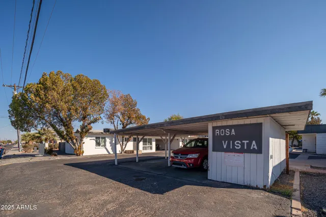 a front view of house with a garden and parking space