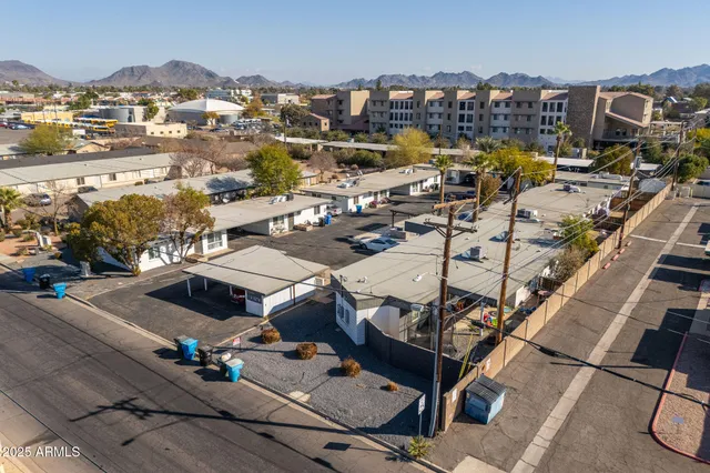 an aerial view of a house with parking space