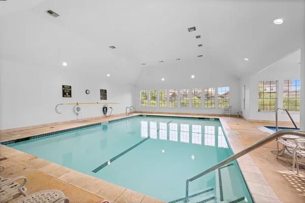 a view of a swimming pool and a living room