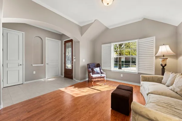 a living room with furniture and a window