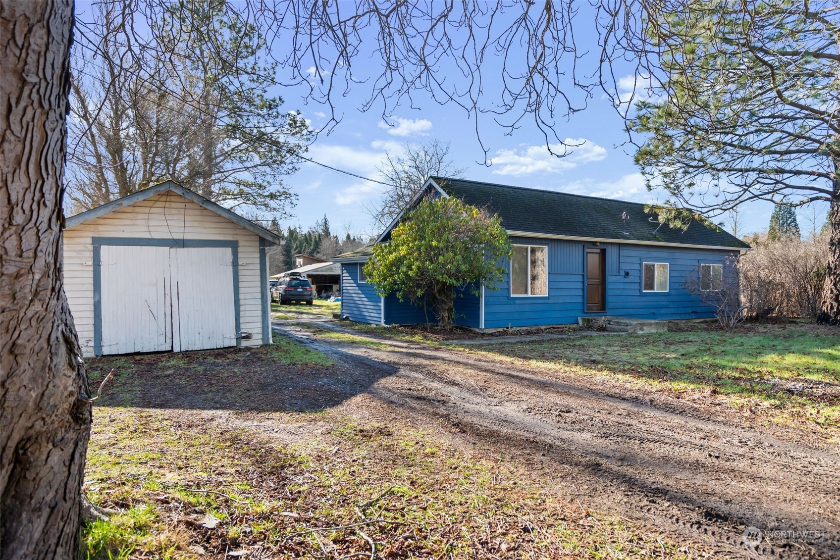 3155 Mountain View Road Ferndale, WA 98248 - Photo 1 of 31 a front view of a house with a yard and garage