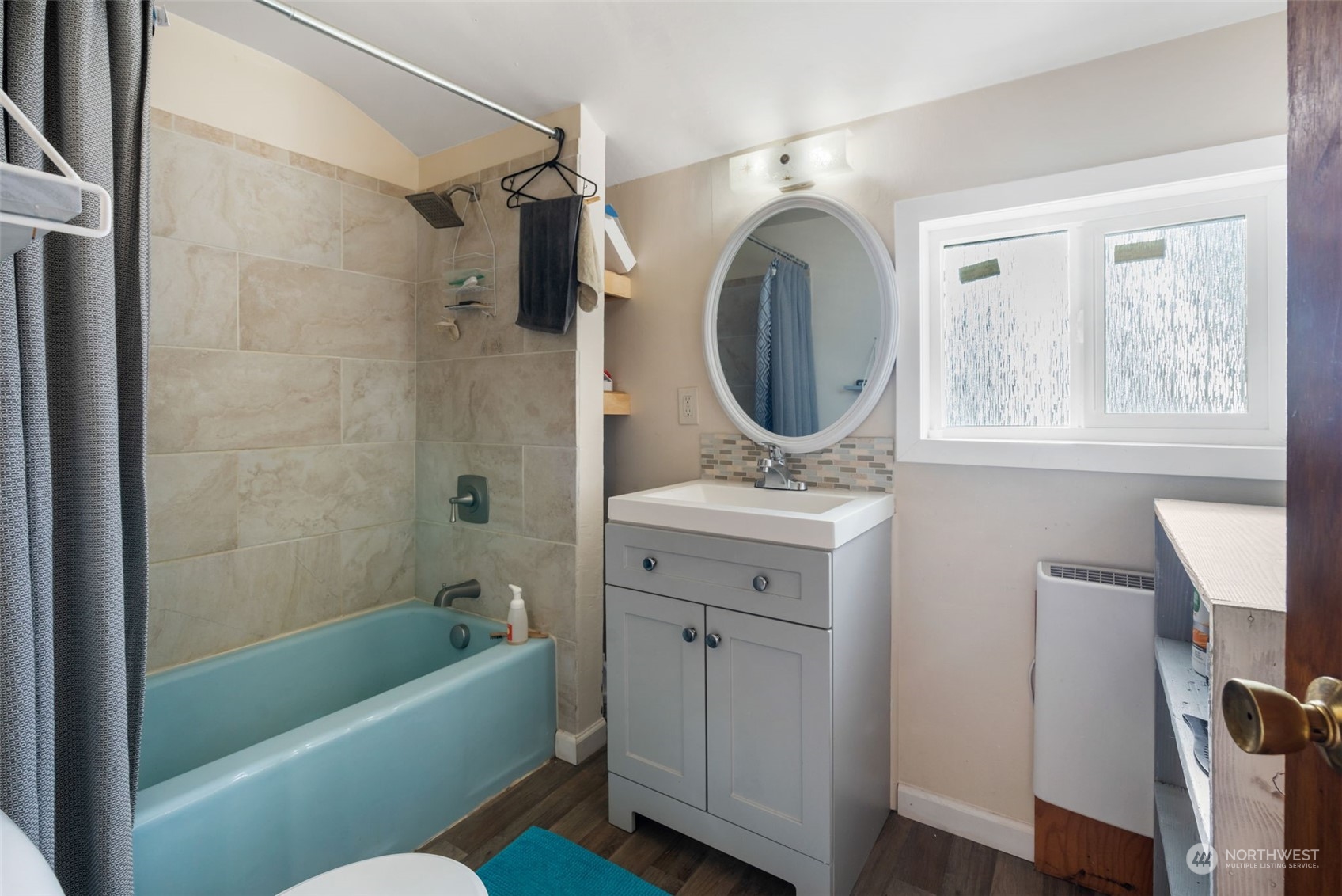 3155 Mountain View Road Ferndale, WA 98248 - Photo 13 of 31 a bathroom with a sink a mirror toilet and bathtub