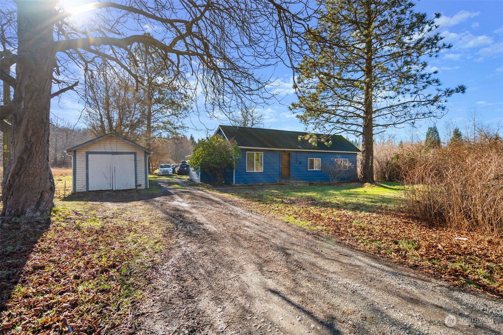 3155 Mountain View Road Ferndale, WA 98248 - Photo 3 of 31 a front view of a house with a yard and a large tree