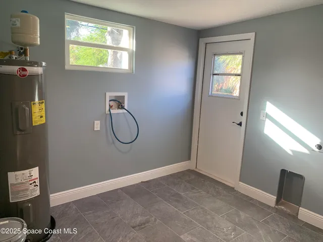 a room with window and bathroom