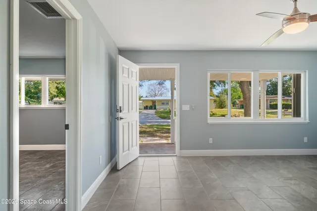 a view of an empty room with a window