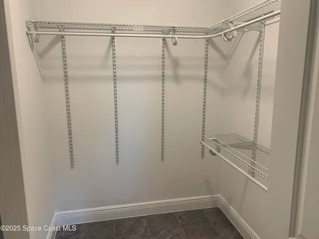 a view of a room with racks on the wall