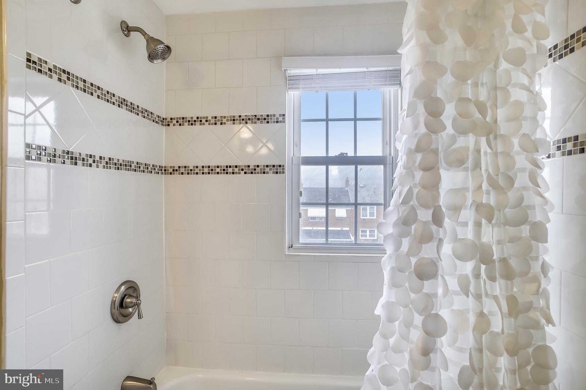 1409 Langford Road Baltimore, MD 21207 - Photo 21 of 39 a bathroom with a shower