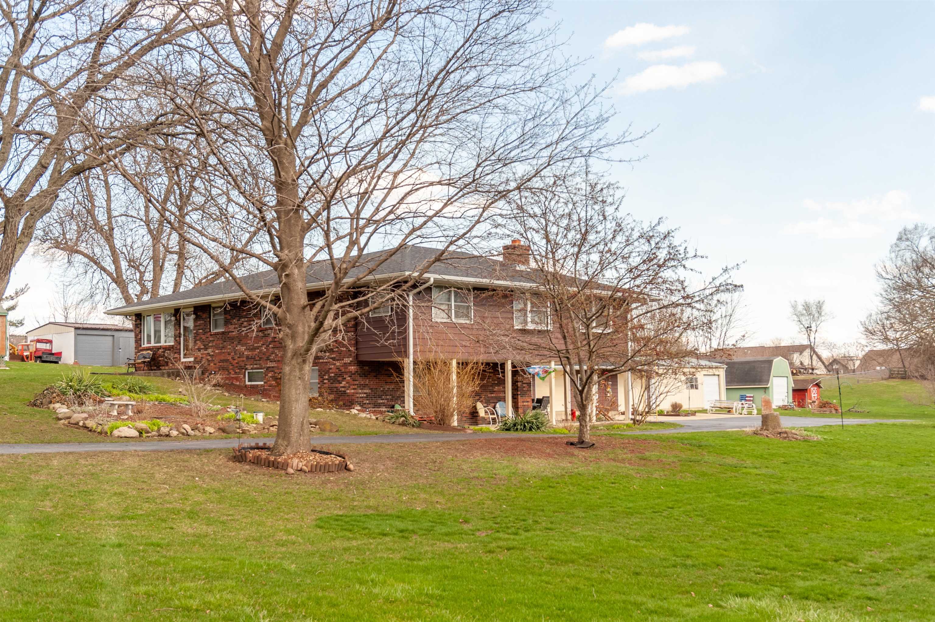 2315 Harlem Crest Road Loves Park, IL 61111 - Photo 4 of 41 a front view of a building with garden