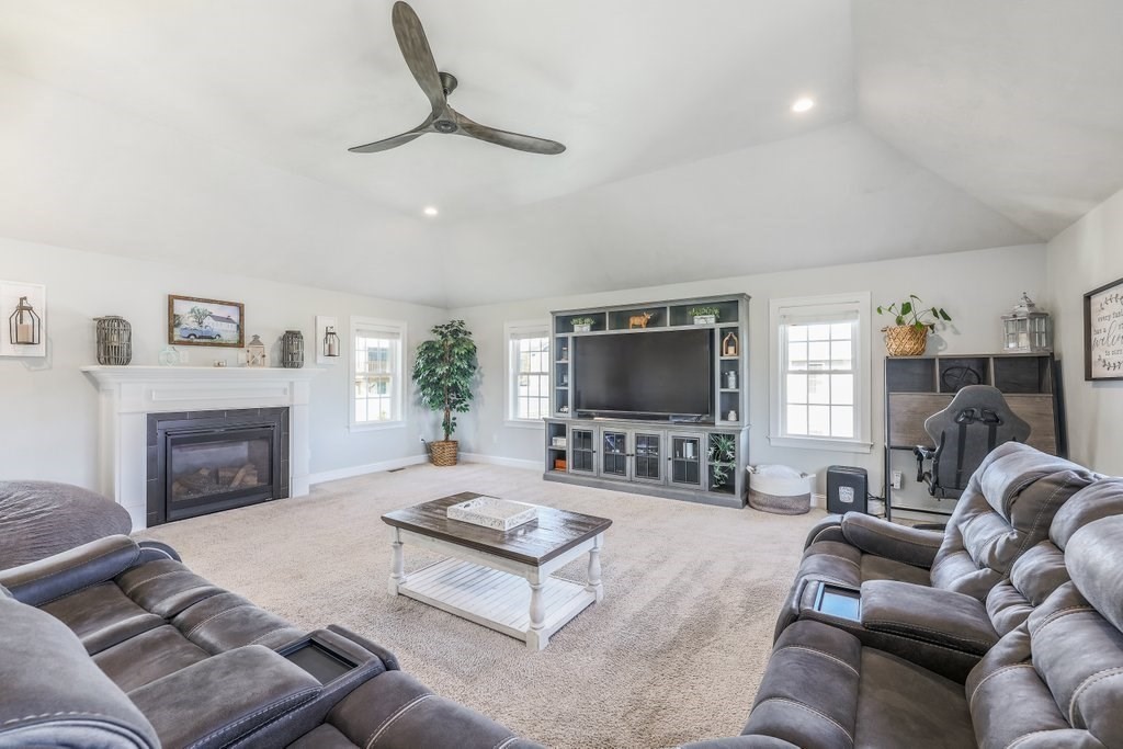 51 Woodside Avenue Rutland, MA 01543 - Photo 14 of 24 a living room with furniture a flat screen tv and a fireplace