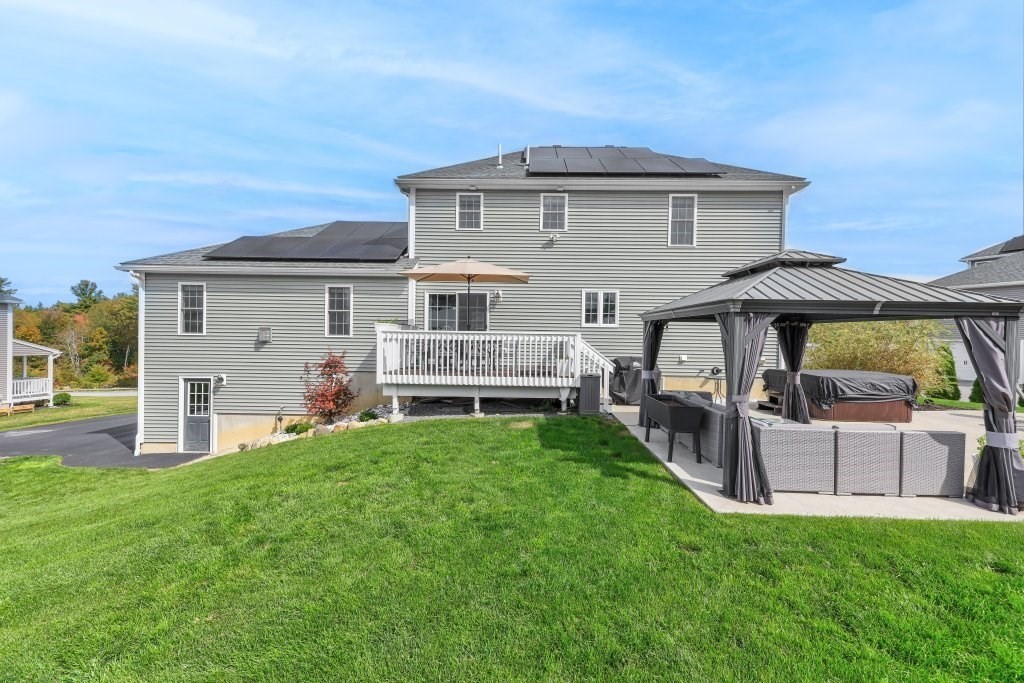 51 Woodside Avenue Rutland, MA 01543 - Photo 4 of 24 a front view of a house with a garden and porch